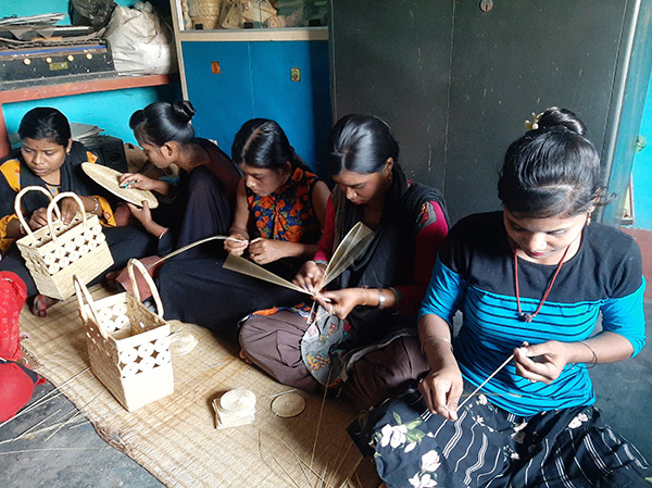 Women learning grass weaving at the workshop - Jindal Stainless